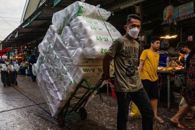 A worker at a market in Bangkok in June 2026.