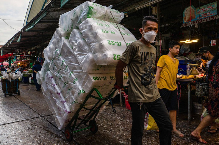 A worker at a market in Bangkok in June 2026.