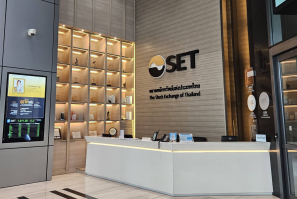 Interior of the Stock Exchange of Thailand featuring a reception area and digital display